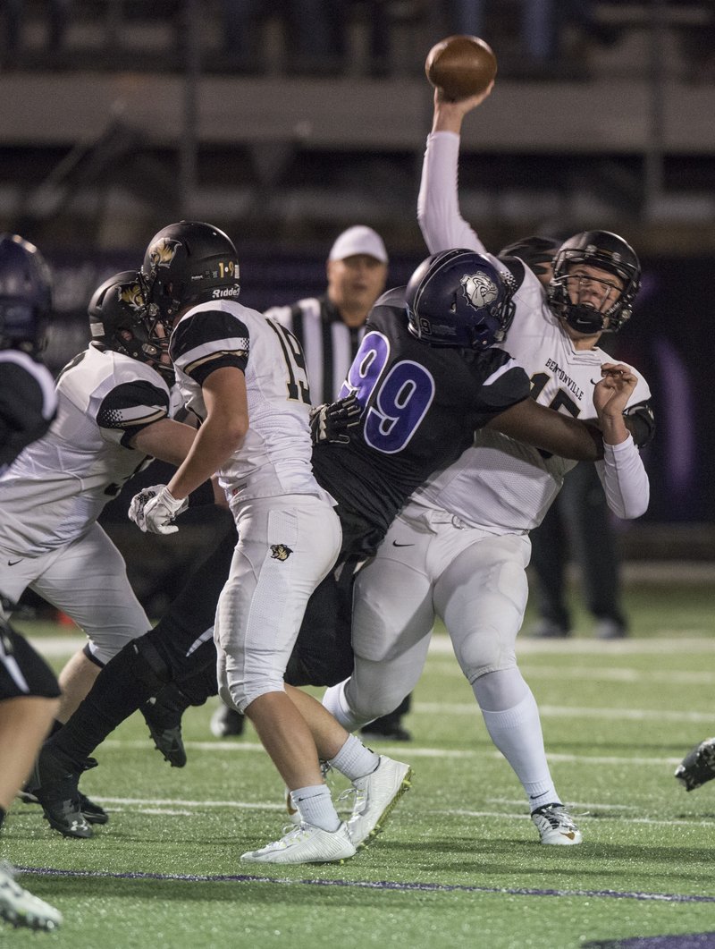 Kary Collier Bentonville senior defensive back, tackles Tyson Morris, Fayetteville senior receiver, after a big gain Friday Nov. 6, 2015 at Harmon Play Field in Fayetteville.