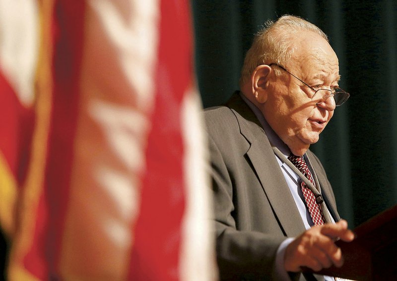 George Abraham, a Holocaust survivor, speaks Friday during the annual Holocaust Conference at the Jones Center in Springdale. “What I think that is important for you, especially the young people among us here, is to not forget what hatred can do,” he said.