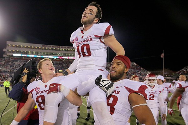 Arkansas quarterback Brandon Allen is carried off the field following the Razorbacks' 53-52 overtime win over Ole Miss on Saturday, Nov. 7, 2015, at Vaught-Hemingway Stadium in Oxford, Miss. 