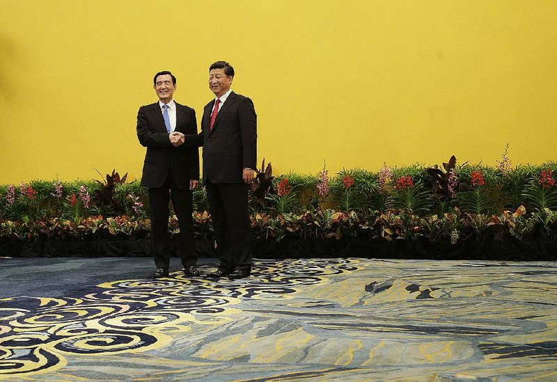 Taiwanese President Ma Ying-jeou (left) and Chinese President Xi Jinping appear together Saturday at the Shangri-la Hotel in Singapore. “History will record this day,” Xi said before the start of a closed meeting.