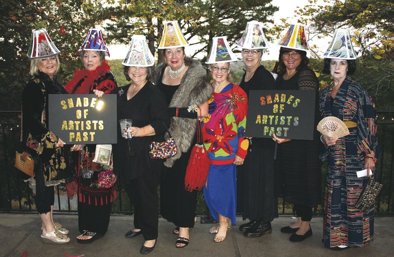 Pat Sweeden (from left), Susan Overgaard, Kelee Overgaard, Judy Thorpe, B.J. Dennis, Teri Round, Tara Lawson and Suzanne McKown, as “Shades of Artists Past,” attend the Mad Hatter Ball on Oct. 23 at the Crescent Hotel in Eureka Springs.