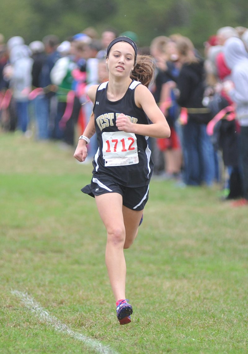 West Fork's Kendall Hayes pushes to the finish Saturday to win the 3A girls cross country at Oaklawn Park in Hot Springs.