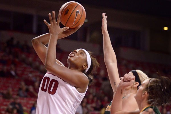 Arkansas' Jessica Jackson makes a shot over the defense of Missouri Southern's Jenson Maydew on Sunday, Nov. 8, 2015, at Bud Walton Arena in Fayetteville.