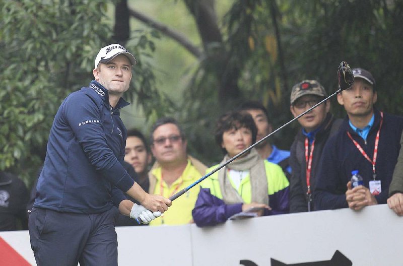 Russell Knox of Scotland looks at his shot on the 7th hole during the final round of the HSBC Champions golf tournament at the Sheshan International Golf Club in Shanghai, China Sunday, Nov. 8, 2015.