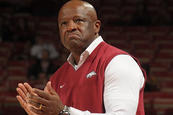 Arkansas coach Mike Anderson applauds his team's play against Southwestern Oklahoma State Thursday, Nov. 5, 2015, during the second half in Bud Walton Arena. 