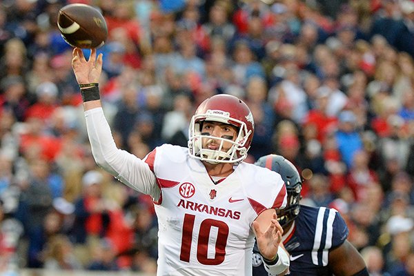 Arkansas quarterback Brandon Allen (10) passes the ball during the second quarter of an NCAA college football game against Mississippi in Oxford, Miss., Saturday, Nov. 7, 2015. (AP Photo/Thomas Graning)