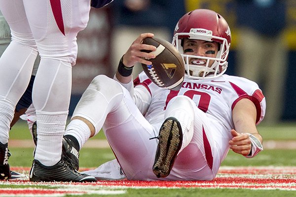 Arkansas quarterback Brandon Allen pulls himself up from turf after being sacked on Saturday, Nov. 7, 2015, during the first quarter against Ole Miss at Vaught-Hemingway Stadium in Oxford, Miss.