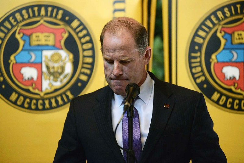 University of Missouri System President Tim Wolfe announces his resignation from office Monday during a meeting of the system’s board of curators in Columbia, Mo.