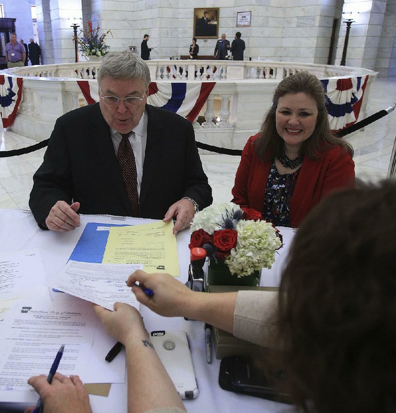 Little Rock businessman Curtis Coleman with his wife, Kathryn, files Monday at the state Capitol to run as a Republican for the U.S. Senate. Coleman will challenge incumbent Sen. John Boozman, R-Ark., in the primary.
