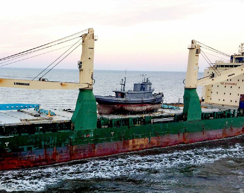 The USS Hoga sits on the deck of a transport ship just outside of Houston on Friday.