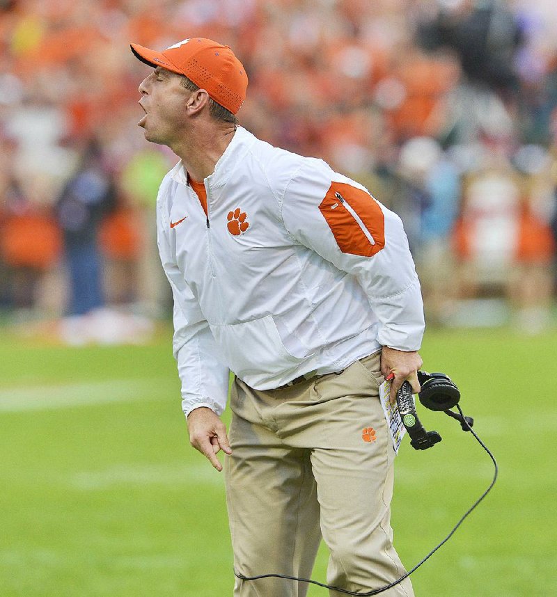 Coach Dabo Swinney and the Clemson Tigers held on to the No. 1 spot in the College Football Playoff poll after defeating Florida State last Saturday.