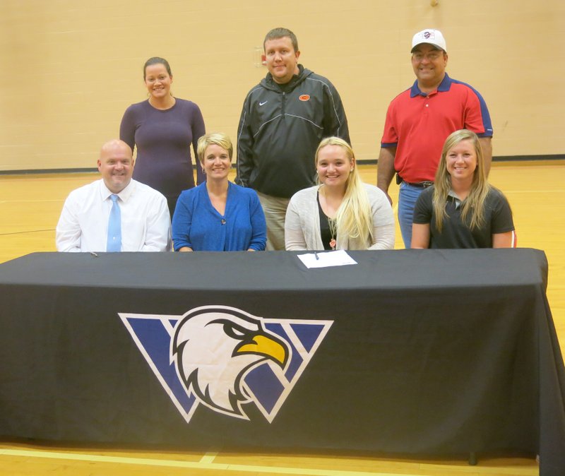 Photo by Susan Holland Jaye Chalk, a senior at Gravette High School, is pictured here just after signing to play college softball at Williams Baptist College in Walnut Ridge. Present for the signing last Wednesday at the high school gymnasium were her parents, Jay and Jennifer Chalk, front left; Chalk; Williams Baptist softball coach Laura Tucker; Kayla Shortt, assistant Lion softball coach, back left; Taos Jones, Gravette Lion softball coach; and Barry Dickinson, Oklahoma Diamond Girls softball coach.