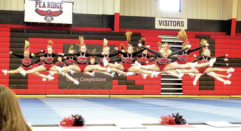 Photograph courtesy of Morganne Rhine Pea Ridge Blackhawk cheerleaders hosted cheer competition Saturday in PRHS gym. The Blackhawks placed second behind Shiloh, according to cheer coach Noelle Littrell-Webb. There were five teams competiting in that category. In addition to Pea Ridge and Shiloh, Booneville, Ozark and Gentry competed. Blackhawks Leslie Austin, Nicole Henson, Shelby Morgan and Tina Cotton took first place in the stunt competition and Rebecca Woods earned second place in the jump competition.