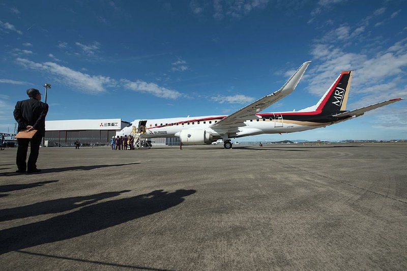 Mitsubishi Aircraft Corp.’s Mitsubishi Regional Jet sits on the apron Wednesday at Nagoya Airport in Toyoyama, Japan, after its debut flight.