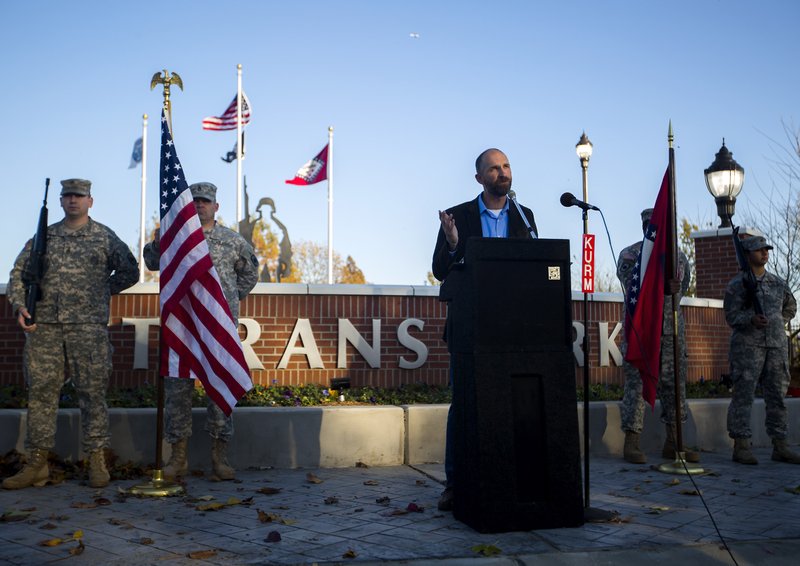 Greg Lindley, Rogers parks commissioner, speaks Wednesday during an opening for Veterans Park in Rogers.