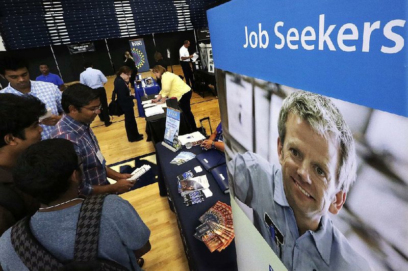 Students attend The Foot in the Door Career Fair at the University of Illinois in Springfield in September. The number of positions waiting to be filled was 5.53 million in September, the Labor Department said Thursday. 