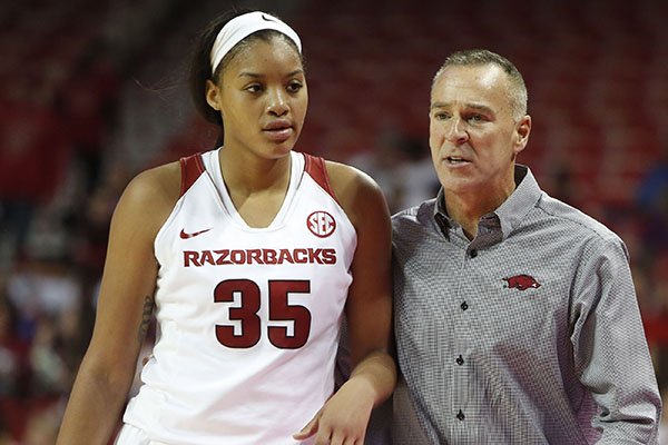 Arkansas coach Jimmy Dykes, right, talks with junior Alecia Cooley during a game against Southeastern Louisiana on Friday, Nov. 13, 2015, at Bud Walton Arena in Fayetteville. 