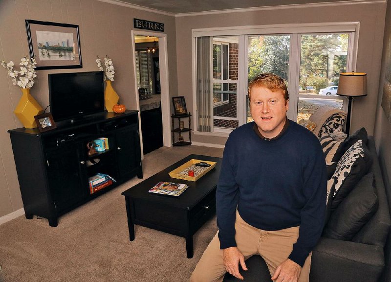 Chris Burks is shown in his den.