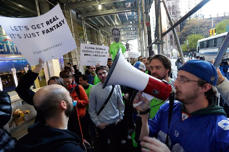 Fantasy sports fans demonstrate outside the Financial District office of New York Attorney General Eric Schneiderman in response to a ruling that fantasy sports sites are illegal gambling operations.