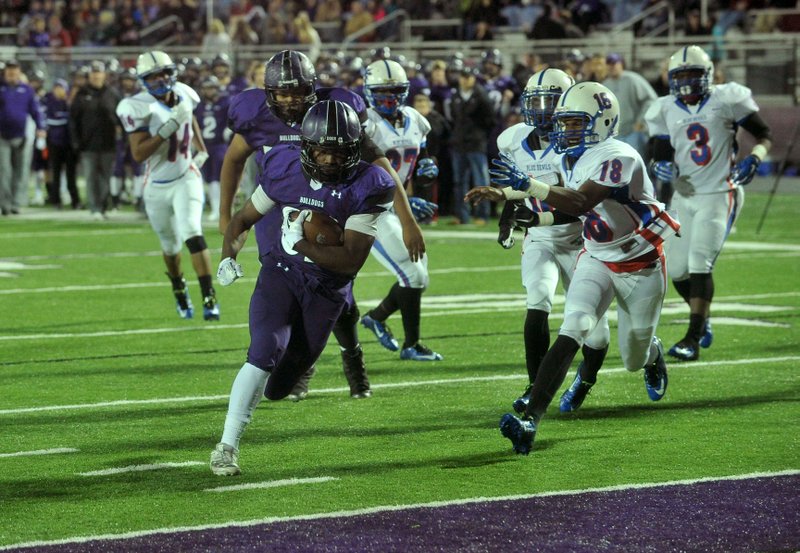 Javontae Smith, Fayetteville High School running back, gets past the West Memphis defense to score a touchdown in the first half November 13, 2015, during Friday nights football game at Harmon Field.