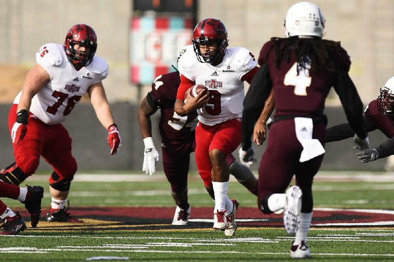 Arkansas State quarterback Fredi Knighten (9) accounted for 322 yards of total offense and six touchdowns to help the Red Wolves beat Louisiana-Monroe 59-21 on Saturday.