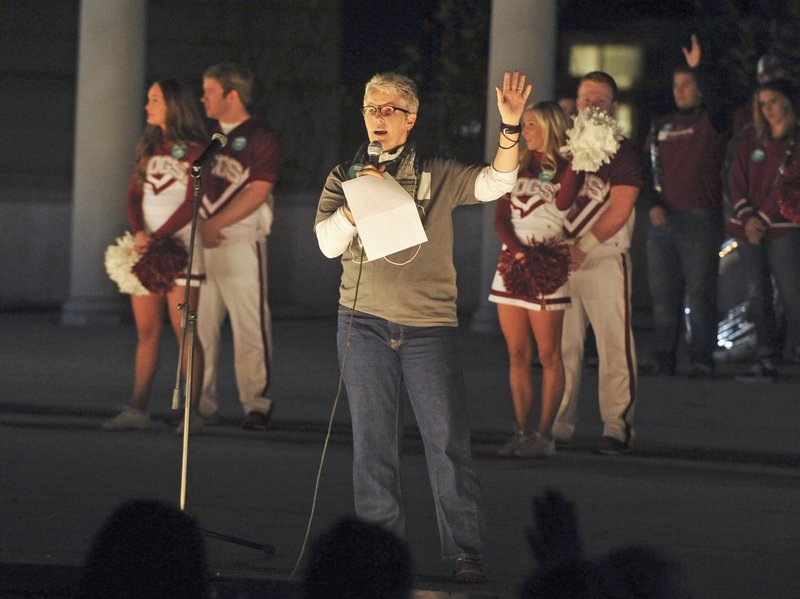 Anne Shelley, executive director of the Northwest Arkansas Rape Crisis Center, speaks to University of Arkansas students Thursday during a rally to raise awareness about sexual assault.