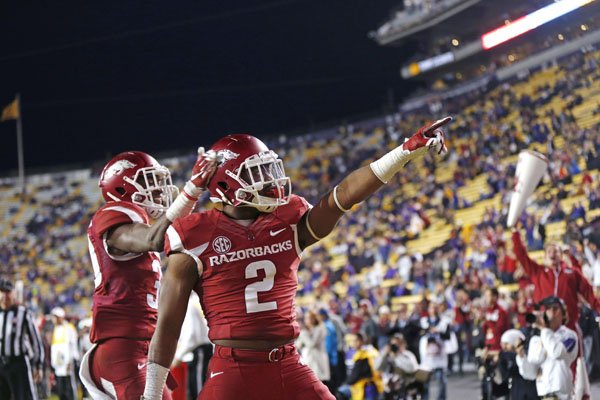 Arkansas defensive back D.J. Dean (2) celebrates his interception in the LSU end zone in the second half of an NCAA college football game in Baton Rouge, La., Saturday, Nov. 14, 2015. Arkansas won 31-14. (AP Photo/Gerald Herbert)