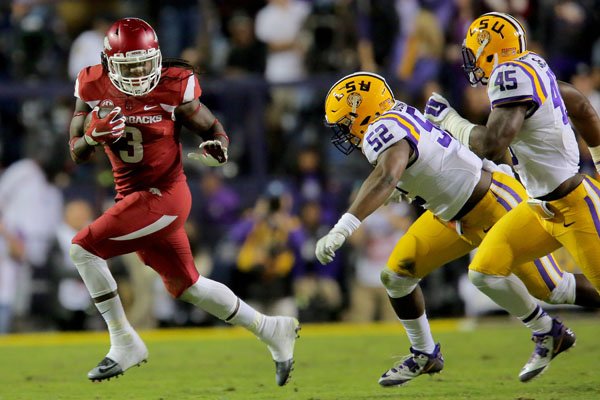 Arkansas' Alex Collins runs against LSU in the third quarter Saturday, Nov. 14, 2015, in Baton Rouge, La.