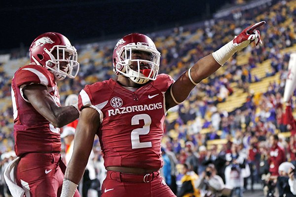 Arkansas defensive back D.J. Dean (2) celebrates his interception in the LSU end zone in the second half of an NCAA college football game in Baton Rouge, La., Saturday, Nov. 14, 2015. Arkansas won 31-14. (AP Photo/Gerald Herbert)