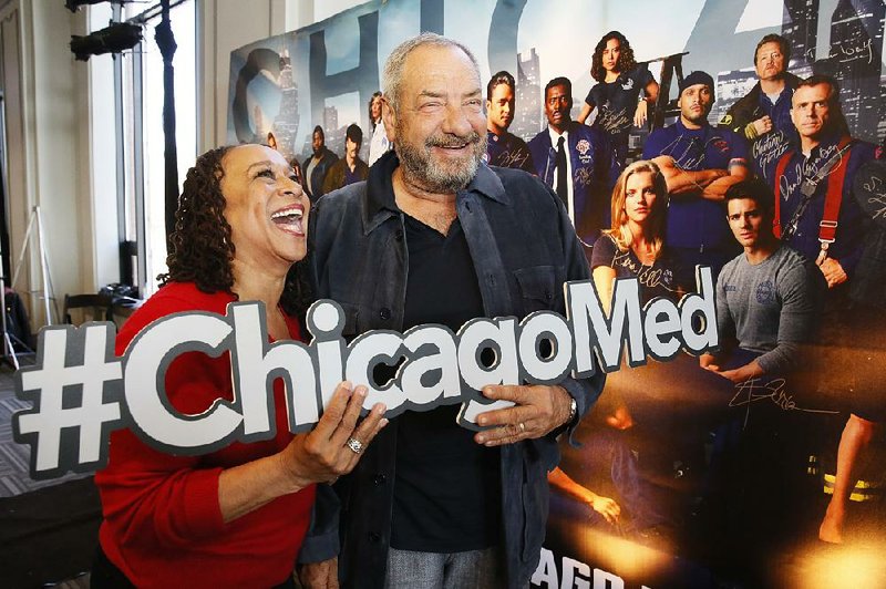 Series star S. Epatha Merkerson shares a laugh with producer Dick Wolf at a Chicago Med publicity event earlier this month.