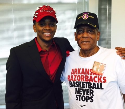 Daryl Macon and his grandfather, Robert Lee Harrison pose after his signing with the Hogs. 