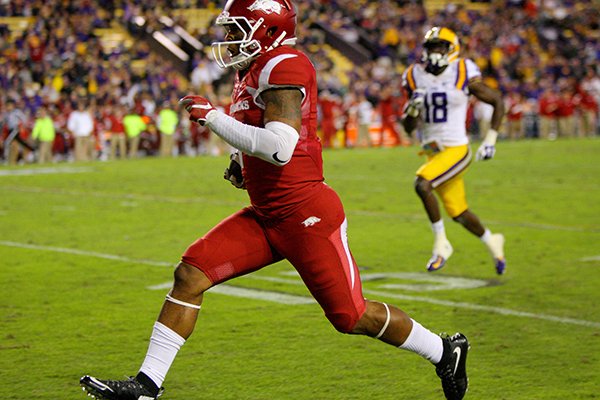 Arkansas receiver Jared Cornelius scores on a 69-yard touchdown run during the fourth quarter of a game against LSU on Saturday, Nov. 14, 2015, in Baton Rouge, La. 