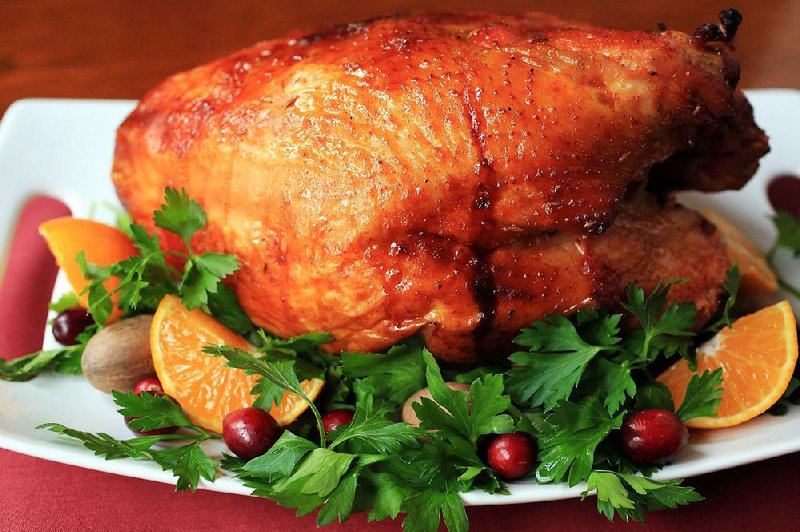 Roast turkey is a common Thanksgiving meal centerpiece. This turkey breast features a smoky-sweet glaze of maple syrup, smoked paprika, cinnamon, cumin and red pepper.