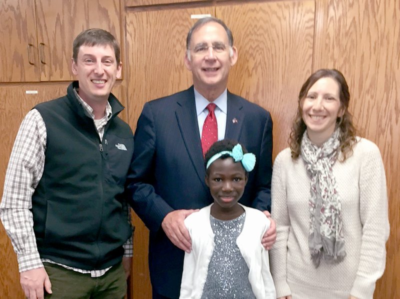 Photo submitted Senator Boozman held his 100th mobile office on Nov. 6 in Fayetteville. The celebration featured a few Arkansans who have been helped by his office, including (from left to right) Mark, Ruth and Tiffany Hansen of Siloam Springs. Boozman&#8217;s office assisted with the Hansen&#8217;s international adoption.