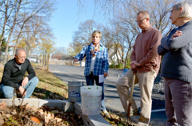 Janelle Jessen/Herald-Leader Master gardener Vicki Halley spoke about composting during a seminar at The Garden in Siloam Springs on Saturday. In addition to providing great fertilizer for gardening, Halley said that regular composting can keep 140 pounds of waste per person out of the landfill each year. Also pictured are Gary Guinn, Frank Hubert and Mary Ann Guinn.