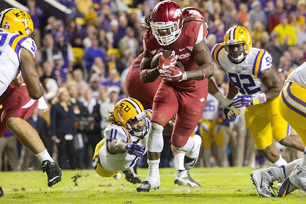 Arkansas running back Alex Collins makes his way into the end zone on Saturday, Nov. 14, 2015, during the second quarter at Tiger Stadium in Baton Rouge, La.