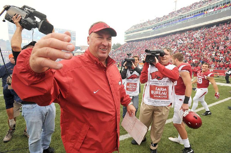 NWA Democrat-Gazette/MICHAEL WOODS ‚Ä¢ @NWAMICHAELW
University of Arkansas players coach Bret Bielema celebrates with his team after the Arkansas Razorbacks 54-46 win in 4 overtimes over Auburn after Saturdays game at Razorback Stadium in Fayetteville.