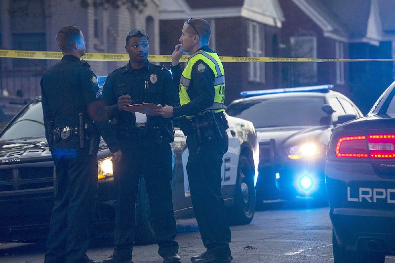Little Rock police officers investigate the shooting of a 6-year-old boy at 3400 Lamar St. late Wednesday afternoon in Little Rock. The child, who police did not identify, died a short time later at Arkansas Children’s Hospital. 