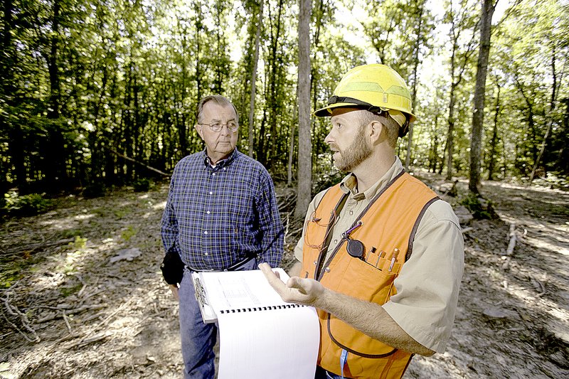 Photo submitted MDC forester Aaron Holsapple tours the property of John Ringwald and goes over a forest management plan.
