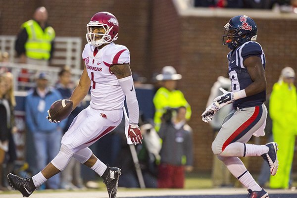 Arkansas wide receiver Jared Cornelius finishes a catch in the end zone for a score on Saturday, Nov. 7, 2015, during the third quarter against Ole Miss at Vaught-Hemingway Stadium in Oxford, Miss.
