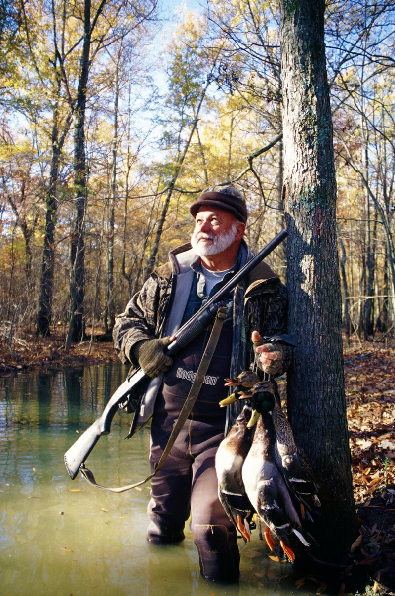 Sammie Faulk of Lake Charles, La., enjoys a peaceful moment after a successful duck hunt on a tract of private land near Humnoke. Many waterfowlers do all their hunting on public areas, but private lands often provide more privacy and better shooting.