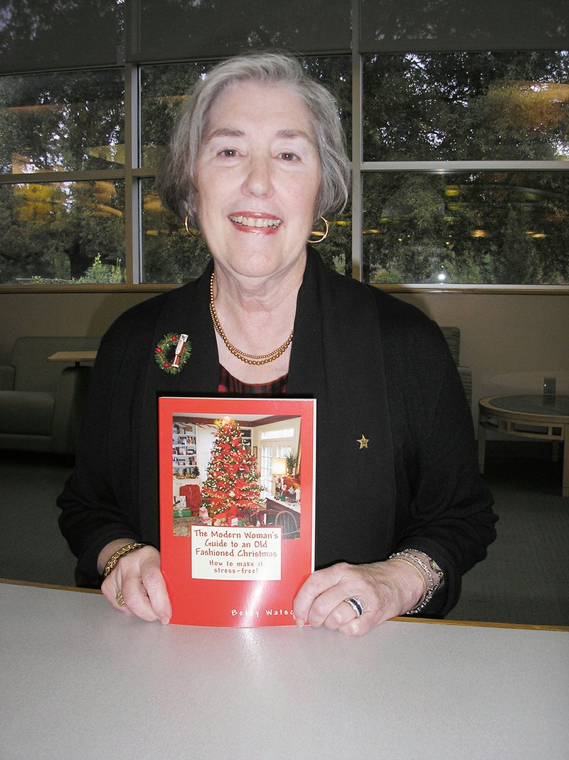 Betsy Watson is shown holding her book The Modern Woman’s Guide to an Old Fashioned Christmas. She wrote the book to help pass down the traditions of celebrating Christmas.