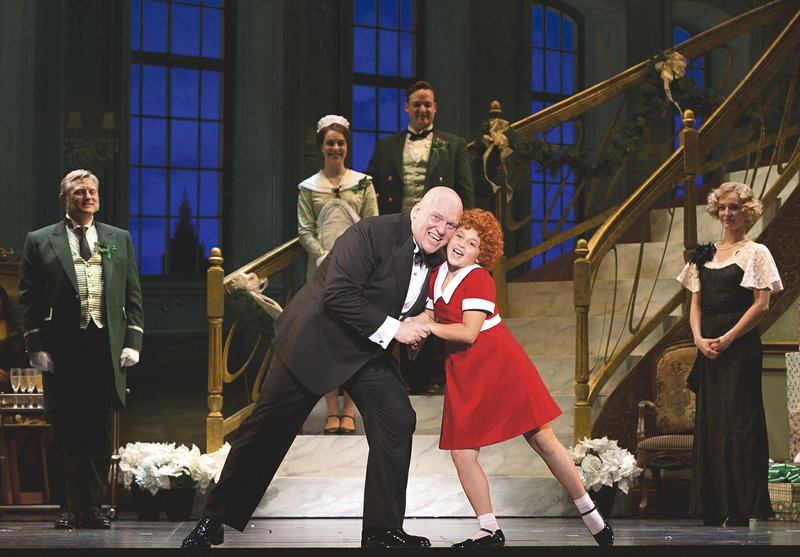 Gilgamesh Taggett and Issie Swickle star as Oliver “Daddy” Warbucks and Annie in the touring production of “Annie.” The show will be at Walton Arts Center in Fayetteville Tuesday through Nov. 29, except Thursday, Thanksgiving Day.