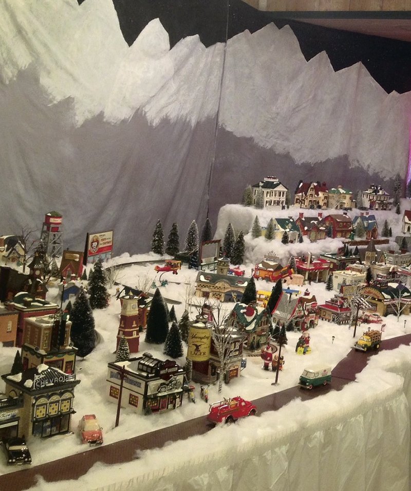 Three town squares bring Christmas to Eureka Springs in the annual Snow Village and Train Exhibit at Gaskins Switch Village, a fundraiser for the Eureka Springs Historical Museum. Larry Handley, family and friends annually create a village scene with his 600 pieces of the Dept. 56 collectibles.