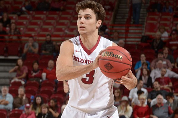 Dusty Hannahs of Arkansas passes the ball on Friday Nov. 20, 2015, during a game against Charleston Southern at Bud Walton Arena in Fayetteville.