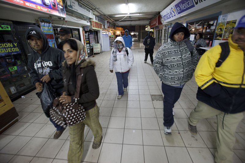 People make their way toward the border to cross in Mexicali, Mexico, on March 7, 2012.