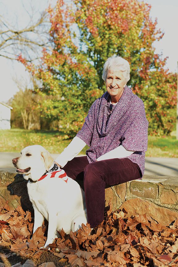 Pat Swain, a retired Quitman police officer, sits outside the Quitman Police Department with her dog, Daisy, who is trained to work with children in the Quitman School District. Swain, a school resource officer for the department, was awarded the Jim Wooley Lifetime Achievement Award at an event in October honoring law enforcement officers. Swain also worked for 29 years as a deputy with the Shelby County Sheriff’s Office in Memphis, Tenn., before moving with her husband, who died in January, to Heber Springs in 2003. Swain is moving back to Tennessee this weekend to be closer to family.