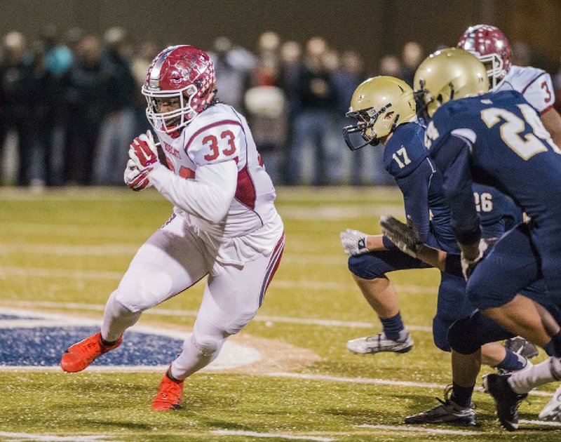 Hope’s McTelvin Agim (33) runs with the ball Friday after recovering a Pulaski Academy onside kick during the Bobcats’ 78-44 loss to the Bruins in the Class 5A state playoffs. For more high school football photos, visit arkansasonline.com/galleries.