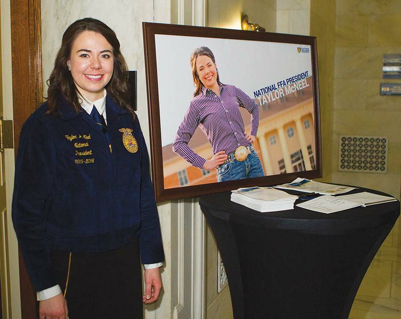 Taylor McNeel stands Nov. 6 with a publicity photograph of herself displayed in the state Capitol in Little Rock, where she held a press conference a few days after being named national FFA president at a convention in Louisville, Ky. McNeel, 20, graduated from Vilonia High School and is an agri-business major with a Spanish minor at Southern Arkansas University in Magnolia. The weeklong process of gaining the office included taking a test, writing an essay, making a speech and spending time with selection-committee members before being named from among 41 candidates.