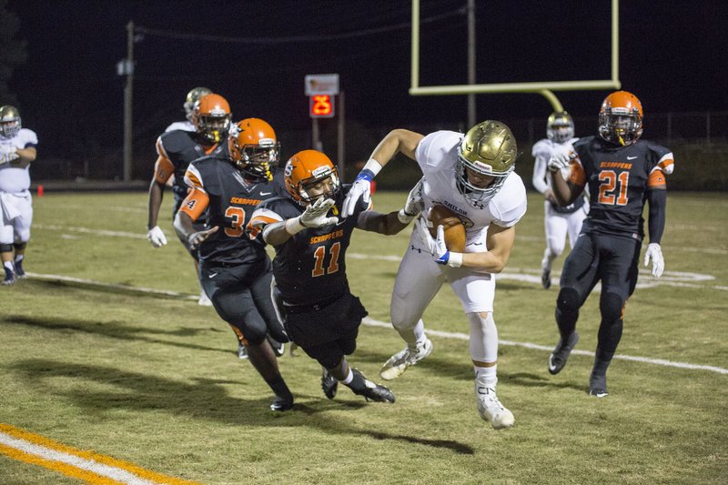 Nashville's Shaundell Scott leaps to tackle Shiloh Christian's Broc Berus at Nashville on Friday, November 20, 2015.